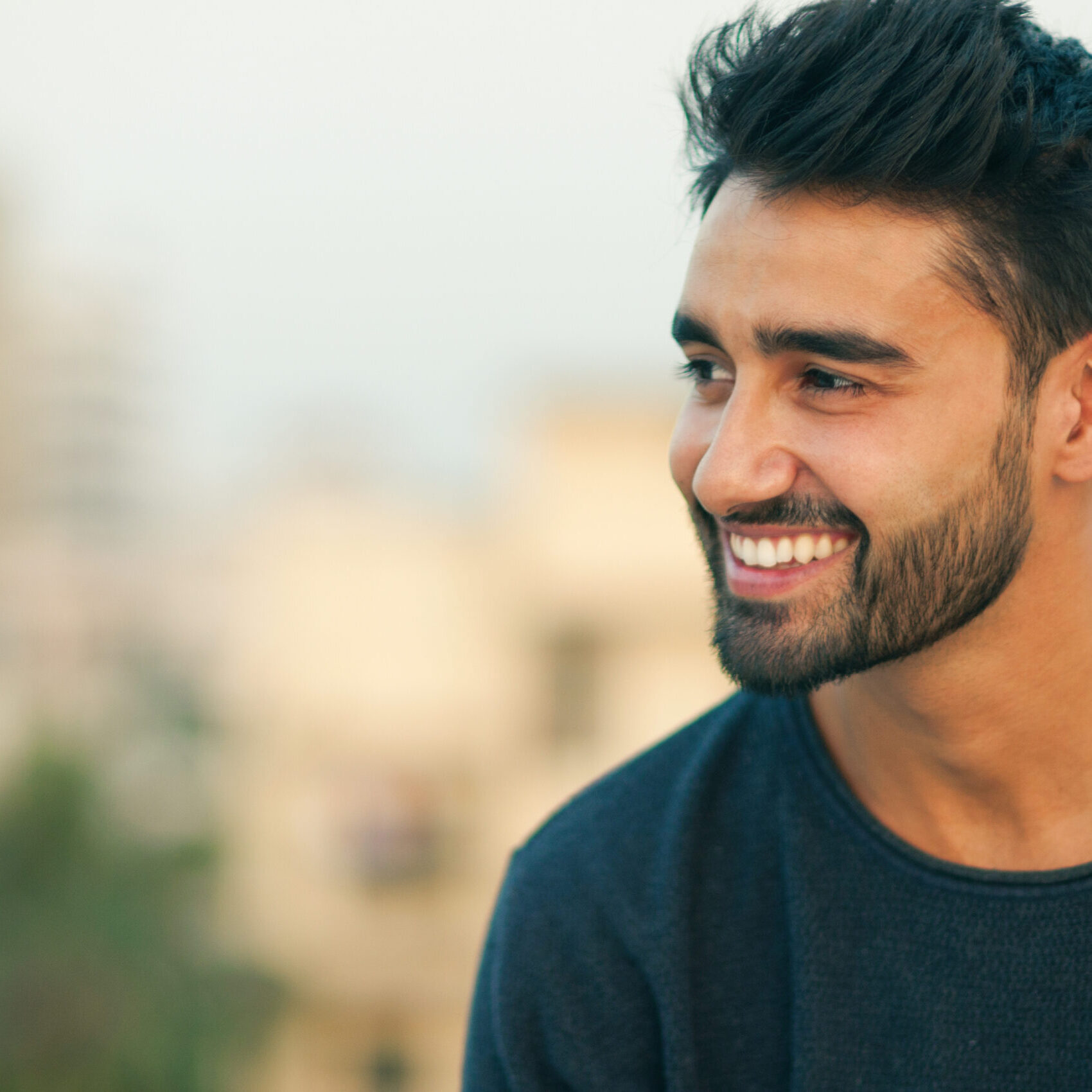 Side view portrait of a beautifull smiling man indian ethnicity