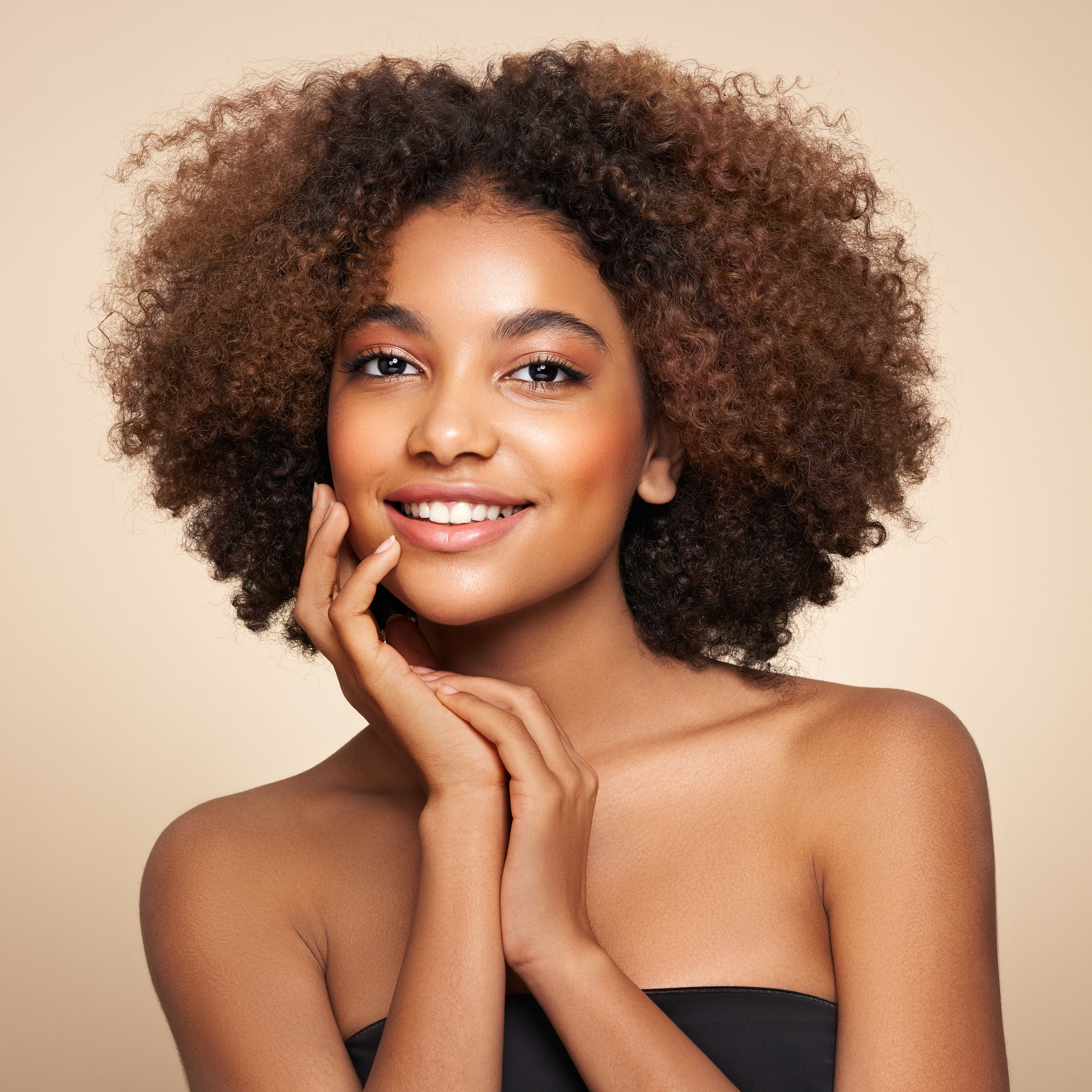 Beauty portrait of African American girl with afro hair. Beautiful black woman. Cosmetics, makeup and fashion